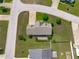 An aerial view of the home shows its location on a corner lot with a large, well-manicured lawn at 124 Willa Chase Ct, Benson, NC 27504