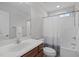 Neutral toned bathroom featuring a tub/shower combo and single vanity at 124 Willa Chase Ct, Benson, NC 27504