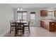 Cozy dining area with seating for four and an overhead light fixture at 124 Willa Chase Ct, Benson, NC 27504