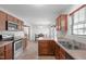 Practical kitchen with matching appliances and access to a dining area at 124 Willa Chase Ct, Benson, NC 27504