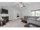 Well-lit living room featuring a fireplace and open access to other rooms at 124 Willa Chase Ct, Benson, NC 27504