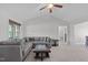 Spacious living room featuring neutral paint colors, a ceiling fan and carpet at 124 Willa Chase Ct, Benson, NC 27504