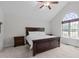 Bedroom with an arched window providing natural light and a ceiling fan at 124 Willa Chase Ct, Benson, NC 27504