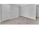 Neutral bedroom featuring wall-to-wall carpeting, fresh paint and ample closet space at 129 Davis St, Louisburg, NC 27549