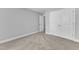 Bedroom featuring plush carpeting, fresh paint and ample closet space at 129 Davis St, Louisburg, NC 27549