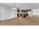 Well-lit kitchen featuring a center island, stainless steel appliances, and granite countertops at 129 Davis St, Louisburg, NC 27549