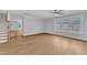 Bright living room featuring large windows and hardwood floors at 129 Davis St, Louisburg, NC 27549