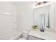 Bathroom features a bathtub, a vanity with quartz countertop and a large mirror for a refreshing space at 1410 Malcus Ct # 55, Fuquay Varina, NC 27526