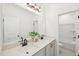 Bathroom featuring double sinks, modern fixtures, a large mirror and stylish cabinets for a spa-like experience at 1410 Malcus Ct # 55, Fuquay Varina, NC 27526