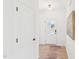Bright entryway with light wood floors, white walls, and a stylish front door with glass panel at 1410 Malcus Ct # 55, Fuquay Varina, NC 27526