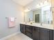 Double sink bathroom with large framed mirror at 149 Wards Ridge Dr, Cary, NC 27513