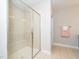 Tiled bathroom features a glass shower with built-in bench at 149 Wards Ridge Dr, Cary, NC 27513