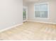 Neutral bedroom with carpet, window, and door to the porch at 149 Wards Ridge Dr, Cary, NC 27513