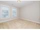 Bright, carpeted bedroom with two windows at 149 Wards Ridge Dr, Cary, NC 27513