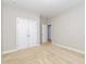 A cozy bedroom is shown with neutral walls, carpet and a closet at 149 Wards Ridge Dr, Cary, NC 27513