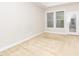 Well-lit bedroom with neutral carpet, a large window, and glass exterior door at 149 Wards Ridge Dr, Cary, NC 27513