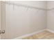 Walk-in closet with wire rack shelving and neutral carpet at 149 Wards Ridge Dr, Cary, NC 27513