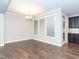 Elegant dining area with hardwood floors, a chandelier, and abundant natural light, perfect for entertaining at 149 Wards Ridge Dr, Cary, NC 27513