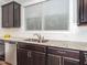 Close-up of modern kitchen with granite countertops, stainless steel dishwasher and sink at 149 Wards Ridge Dr, Cary, NC 27513