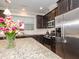 Granite countertops and stainless appliances give a luxurious feel to this kitchen space at 149 Wards Ridge Dr, Cary, NC 27513