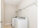 Laundry room with full-sized washer and dryer and wire shelving at 149 Wards Ridge Dr, Cary, NC 27513