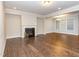 Inviting living room featuring a cozy fireplace, hardwood floors, and ample natural light at 149 Wards Ridge Dr, Cary, NC 27513