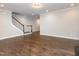 Bright living area featuring hardwood floors, staircase and recessed lighting at 149 Wards Ridge Dr, Cary, NC 27513