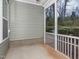 Back porch featuring a screened area and gray siding at 149 Wards Ridge Dr, Cary, NC 27513