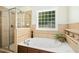 Luxurious bathroom with a soaking tub and a separate glass-enclosed shower at 150 Georgetown Woods Dr, Youngsville, NC 27596