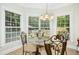 Bright breakfast nook with large windows providing backyard views at 150 Georgetown Woods Dr, Youngsville, NC 27596