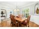 Refined dining room featuring a wooden dining table set, intricate trim and bright light at 150 Georgetown Woods Dr, Youngsville, NC 27596