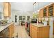 Eat-in kitchen with tiled floors, stainless steel appliances, and lots of natural light at 150 Georgetown Woods Dr, Youngsville, NC 27596