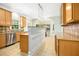 Bright eat-in kitchen featuring an island, tiled floors, neutral cabinets, and stainless steel appliances at 150 Georgetown Woods Dr, Youngsville, NC 27596