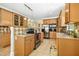 Spacious kitchen with stainless steel appliances, a large island, and tiled floor at 150 Georgetown Woods Dr, Youngsville, NC 27596