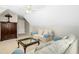 Upstairs bonus room with seating, carpet, and a dark wood cabinet at 150 Georgetown Woods Dr, Youngsville, NC 27596