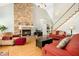 Spacious living room with stone fireplace, hardwood flooring, and staircase at 150 Georgetown Woods Dr, Youngsville, NC 27596