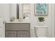 Bathroom with gray vanity, white countertop, modern faucet, and a decorative print at 1548 Bright Coral Trl, Wendell, NC 27591