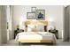 Bright bedroom featuring a stylish wooden bed frame, neutral bedding and decor, and tasteful wall art at 1548 Bright Coral Trl, Wendell, NC 27591