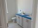 This bathroom features a double vanity with white cabinets and modern fixtures next to a toilet at 1609 Malcus Ct # 67, Fuquay Varina, NC 27526