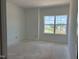 A bedroom with a large window offering a picturesque view of the neighborhood at 1609 Malcus Ct # 67, Fuquay Varina, NC 27526