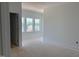 A bright and spacious bedroom with large windows looking out at the neighborhood at 1609 Malcus Ct # 67, Fuquay Varina, NC 27526