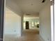 Spacious entryway featuring neutral paint and trim, leading to a bright, unfinished living area at 1609 Malcus Ct # 67, Fuquay Varina, NC 27526