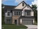 Two-story home featuring stone accents, a gray two-car garage, and a dark gray roof at 1609 Malcus Ct # 67, Fuquay Varina, NC 27526