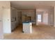 Open-concept kitchen with gray cabinets, island sink, perfect for entertaining, awaiting appliances at 1609 Malcus Ct # 67, Fuquay Varina, NC 27526