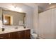 Bathroom with updated vanity, lighting, and shower/tub combo at 1820 Yates Wheel Way, Raleigh, NC 27606