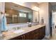Bathroom showcasing double sink vanity with a granite countertop and large mirror at 1820 Yates Wheel Way, Raleigh, NC 27606