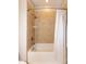 Bathroom featuring tiled tub and shower combo with shower curtain at 1820 Yates Wheel Way, Raleigh, NC 27606