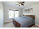 Bedroom featuring a large window and a ceiling fan at 1820 Yates Wheel Way, Raleigh, NC 27606