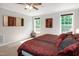 Large bedroom with neutral colored carpet, and two windows to let in natural light at 1820 Yates Wheel Way, Raleigh, NC 27606
