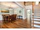 Elegant dining room featuring hardwood floors, staircase, and an open layout great for gatherings at 1820 Yates Wheel Way, Raleigh, NC 27606